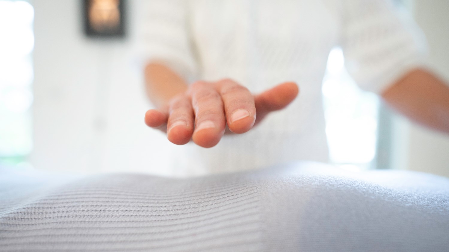 reiki therapy hands over body